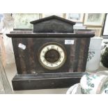 An impressive antique mantle clock with slate body