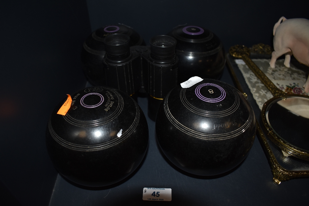 A set of bowls by Thomas Taylor and set of Arena Eschenbach binoculars