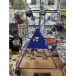 A metal framed model fairground wheel and assorted teddy bear riders