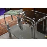 A selection of glass and chrome nest/side tables