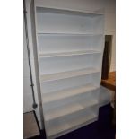 A set of white laminate bookshelves