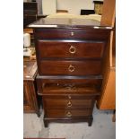 A pair of stag bedside cabinets