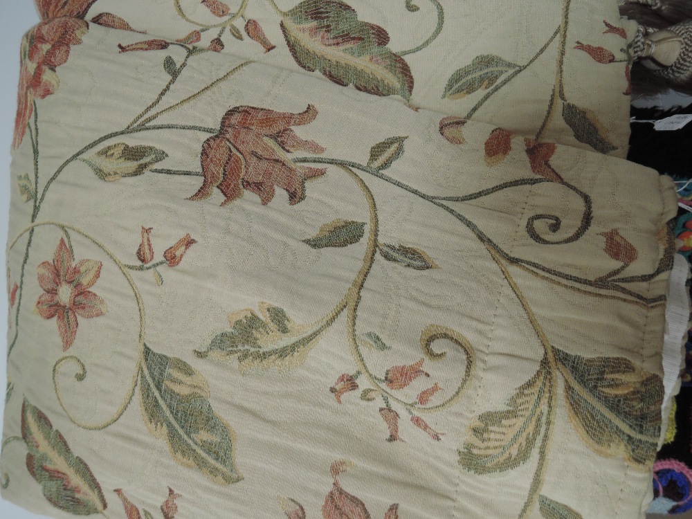 A pair of fully lined beige curtains having floral pattern,good condition.