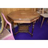 A late Victorian rosewood occasional table having line inlay and foliate decoration on turned legs