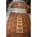 Two modern rugs having russet ground