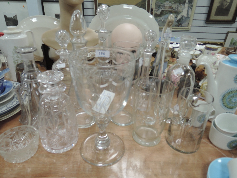 A selection of clear cut crystal glass wares including coronation goblet and decanters