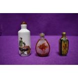Three Japanese snuff bottles, two hand painted one carved one of which are signed