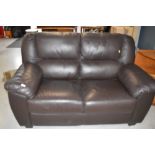 A modern brown leatherette settee