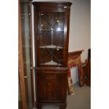 A reproduction Regency mahogany corner display