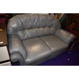 A grey leather settee