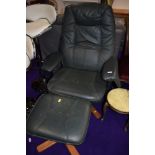 A Stressless style armchair and footstool