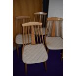 A set of four vintage spindle back dining chairs in the Ercol style