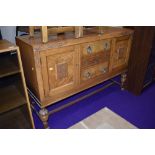 An early to mid 20th Century golden oak sideboard