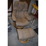 A Stressless armchair and footstool, in beige leather