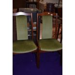 A pair of vintage wood frame and dralon dining chairs