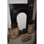 A cast iron fire surround, grate etc