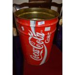 A vintage waste paper bin advertising coca cola