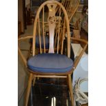 An Ercol carver chair of smaller proportions
