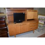 A vintage teak sideboard unit