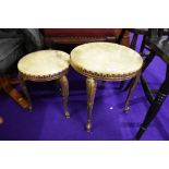 A pair of brass and onyx occasional tables