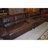 A pair of modern brown leatherette settees, three and two seater