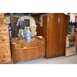 A mid 20th Century oak ply two piece bedroom suite