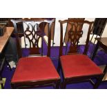 A pair of 19th century mahogany dining chairs in the Chippendale revival style having fret vase