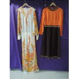 Two vintage maxi dresses, one by Jean Allen, having bright floral print and open sleeves down to the