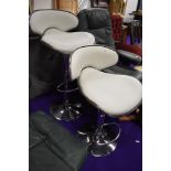 A pair of stylised bar stools