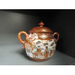 A hardpaste Chinese export sugar bowl or similar highly decorated with floral panels and Geisha