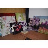 A large selection of canvas prints, mainly floral