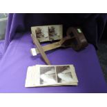A stereoscope un named and a selection of cards by D J Johnson