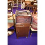 A mid 20th Century ply bedside chest and stained frame wall cabinet