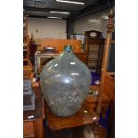 A traditional glass carboy