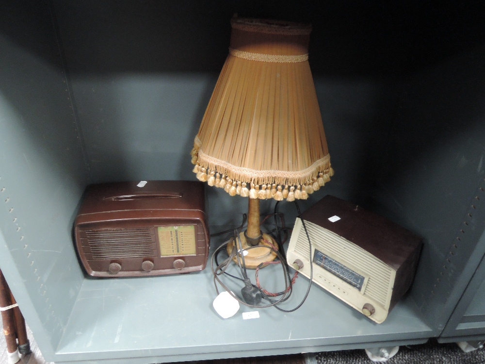 Two bakelite radios and a similar table lamp