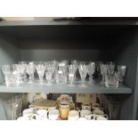A selection of clear cut and crystal glass wares including named brands and Waterford