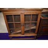 An early 20th Century golden oak bookcase