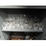 A selection of clear cut and crystal glass wares including antique cut and etched