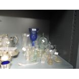 A selection of early glass advertising bottles and similar including blue glass goblet