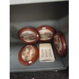 A selection of display plates with game birds and trout flies