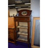 An Edwardian mahogany display cabinet (damaged glass to one side)