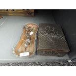 An arts and crafts style hand worked jewellery box and similar copper dish and candle snuffer
