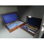 Two mahogany cased geometry sets one with brass instruments