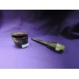 An antique carved animal horn powder container and similar shot flask