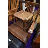 A traditional footstool and carver chair