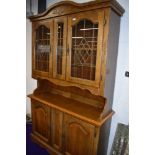 A reprduction glazed top dresser