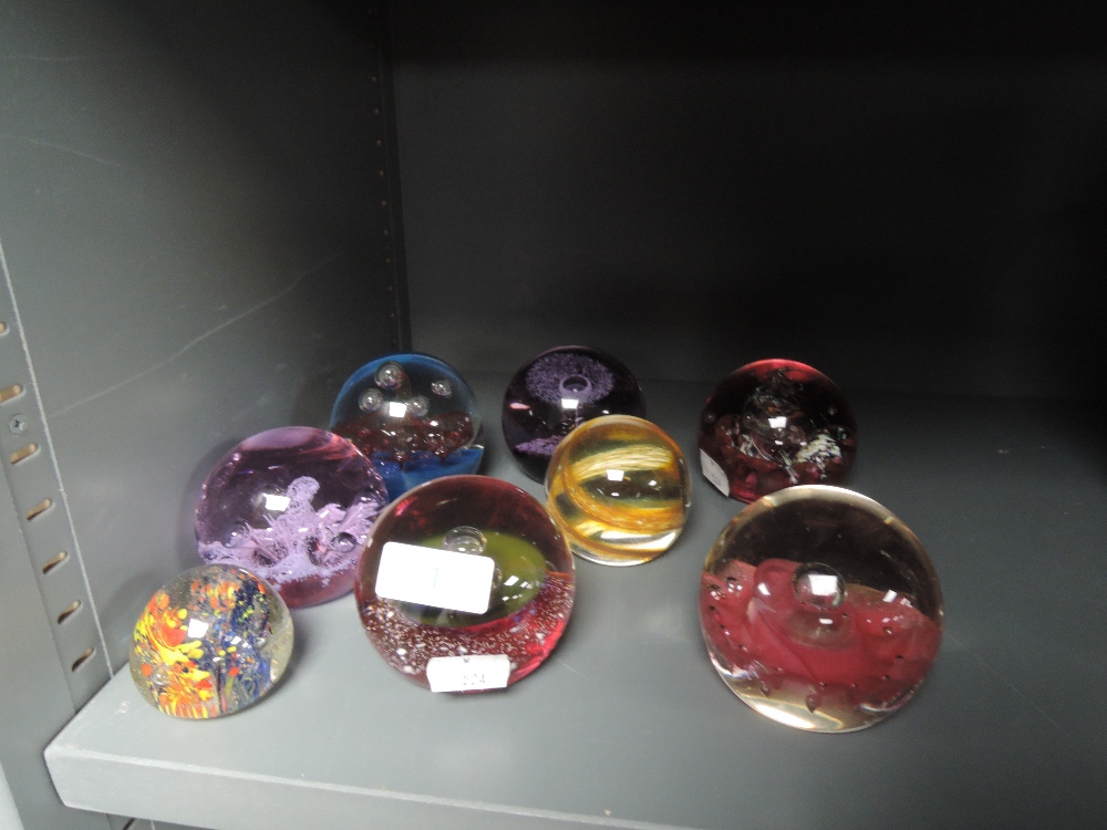 A selection of glass paper weights including Caithness