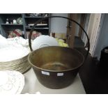 A brass jam pan