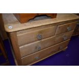A stripped pine chest of two over two drawers