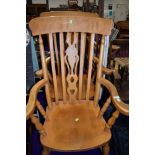 A pair of traditional beech carver chairs